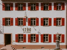 Red shuttered facade - accidential wes anderson - 1280 Krone Design Hotel in Geisingen, Baden-Würtemberg Germany 