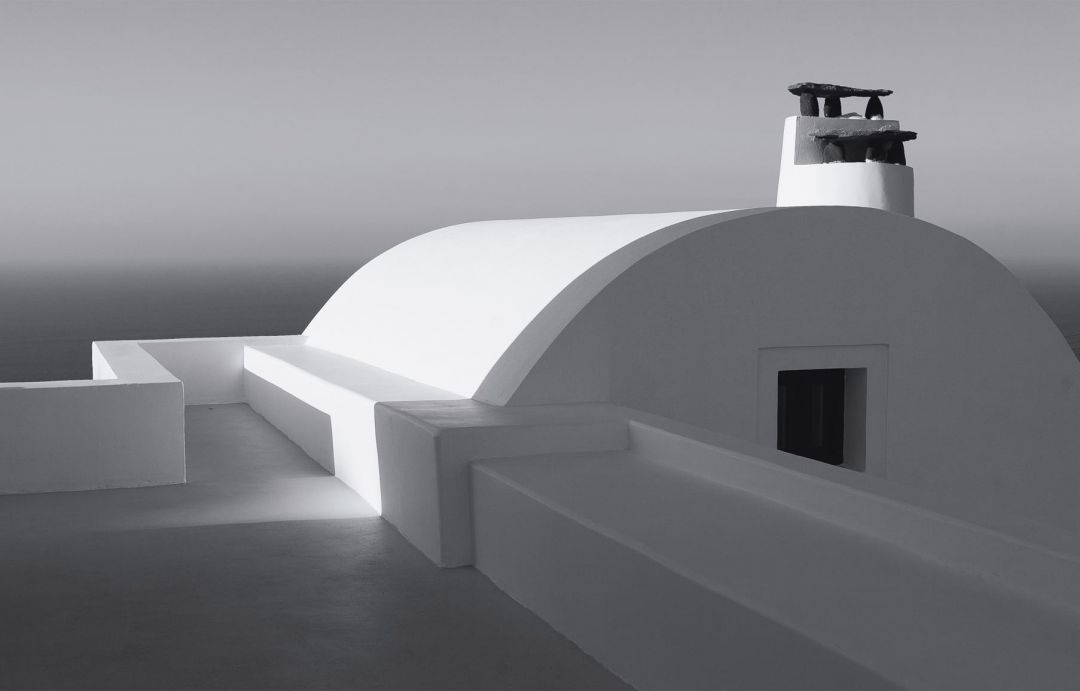 Black & White photograph detailing the curved rooftops of Aenaon Villas Santorini, Greece