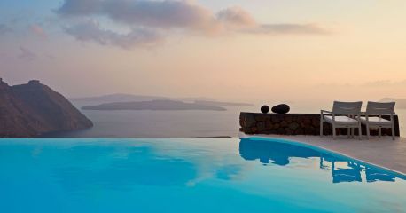 Santorini overlooking the Aegean at sunset | Caldera | Cyclades | Aenaon Villas, Greece | infinity pool in blue 