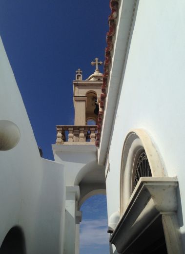 Church architecture, against the blue Aegean seas on the saintly island of Tinos , Greece, Cyclades