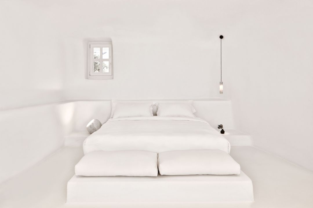 Cycladic archtitecture on Santorini, black on white, typical roof tops at Aenaon Villas Caldera 