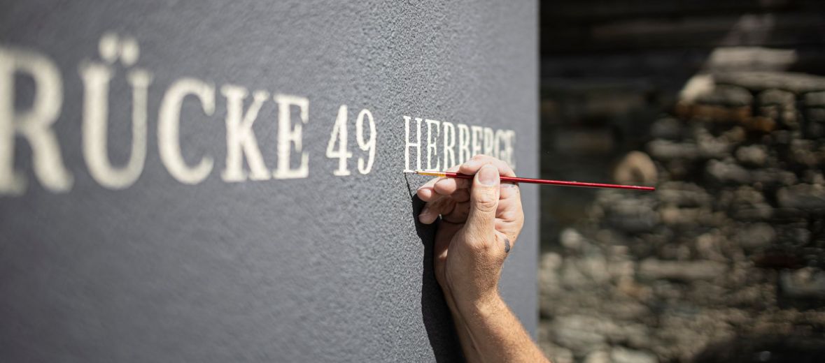 Hand-painted logo Signage | Restoration Stories Brücke 49 | Vals Switzerland | The Aficionados 