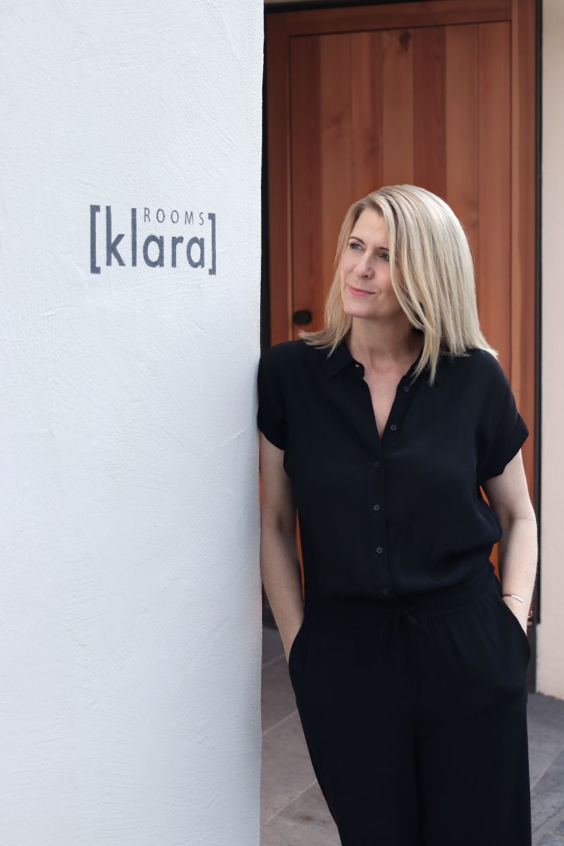 Ramona Ludwig, owner of Klara Rooms, beside the entrance sign — boutique holiday apartments Trittenheim, Moselle Valley, Rhineland-Palatinate Germany | The Aficionados 