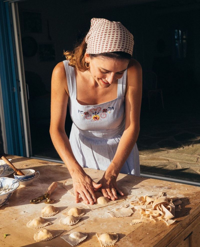 Young woman kneading paste/ bread traditinoal art of cooking | Konfekt - The Smart Magazine for Travel, Fashion, Design & Food by MONOCLE