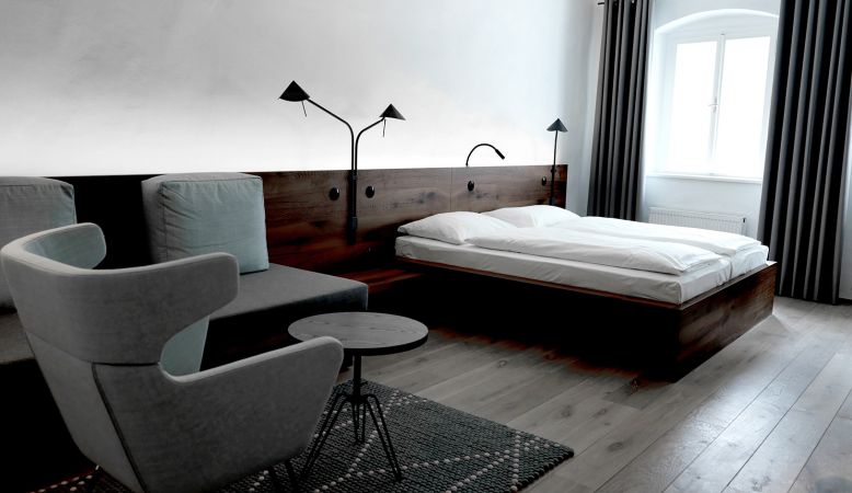 Creatively designed bedrooms of aged walls and modern interior at the Blaue Gans Hotel, Salzburg