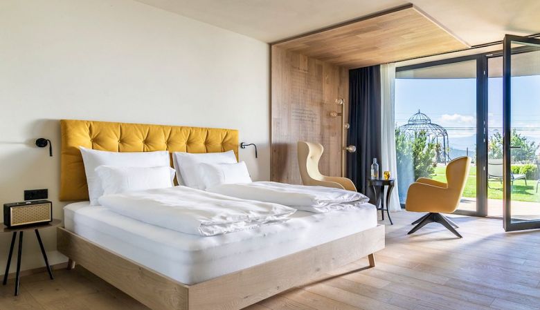 Modern Alpine Bedroom Interior - Gloriette Boutique Hotel Soprabolzano - designed by noa architects, overlooking the Dolomites in South Tyrol, Italy 
