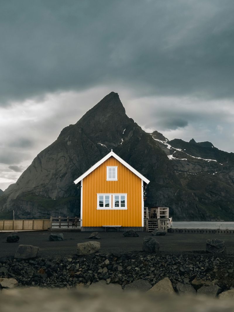 fishing Factory Building Heritage, Norway pained in traditional mustard Yellows to signify its purpose| Nusfjord Arctic Resort & Village Hotel Lofoten | The Colours of Norway – A Design Legacy of Coastal Fishing Villages