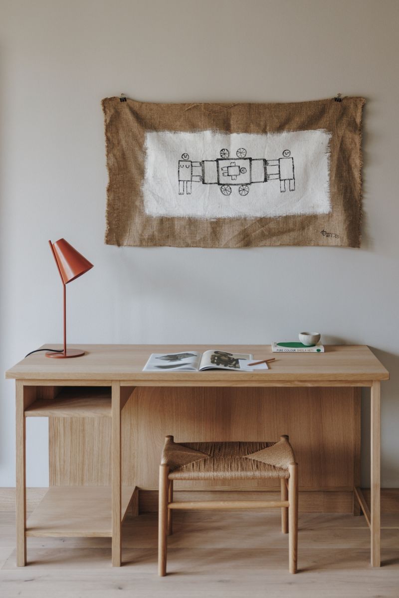 Custom artwork, scandi desk in wood with red copper desk light | Hotel Schwarzschmied Best Wellness and Design Retreat in South Tyrol | The Aficionados 