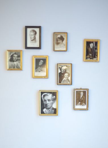 A photograph of the frames hanging on Hotel Altstadt Vienna's room 65's wall, as designed by interior designer Roland Nemetz