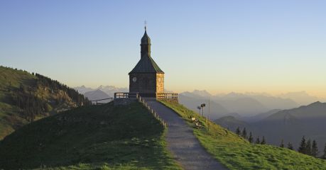 Bavarian landscape that capture the beauty of Bavaria in Germany. Church spire against the alps
