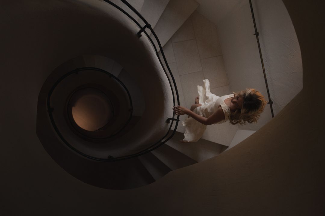 Woman walking down the spiral staircase |Stieg’nhaus | Luxury Design Hotel in Austria’s Hochkönig | The Aficonados 