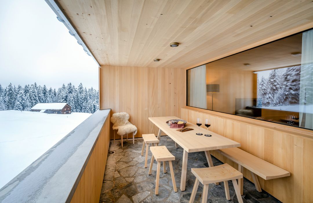 Outdoor balcony terasse winter scene agains tthe snow of the ALps |  Fuchsegg Eco Lodge, Bregenzerwald – Design Hotel in the Austrian Alps, Vorarlberg