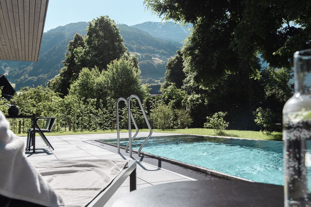 Outdoor Pool in the Alps | Architecture by Alpstein | Amrai Suites Montafon | Luxury Boutique Hotel Accommodation | Design by Alpstein | New Design Hotel in Schruns, Montafon, Vorarlberg Austria | The Aficionados 