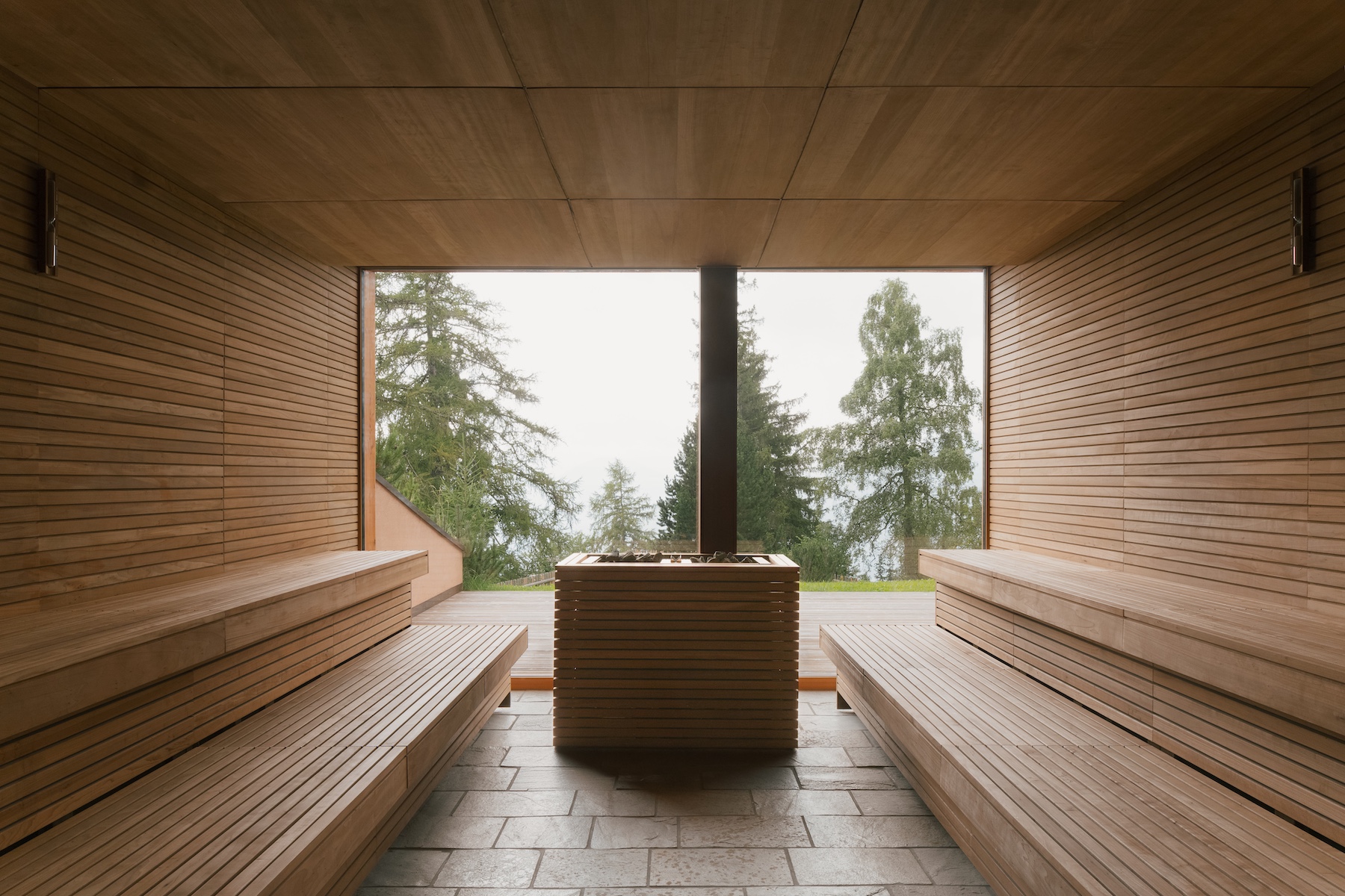 The sauna photgraphed from within - dramatic use of window and wood in the wellness desgin by Matteo Thun |vigilius mountain resort: Holistic Design & Spa Retreat in South Tyrol