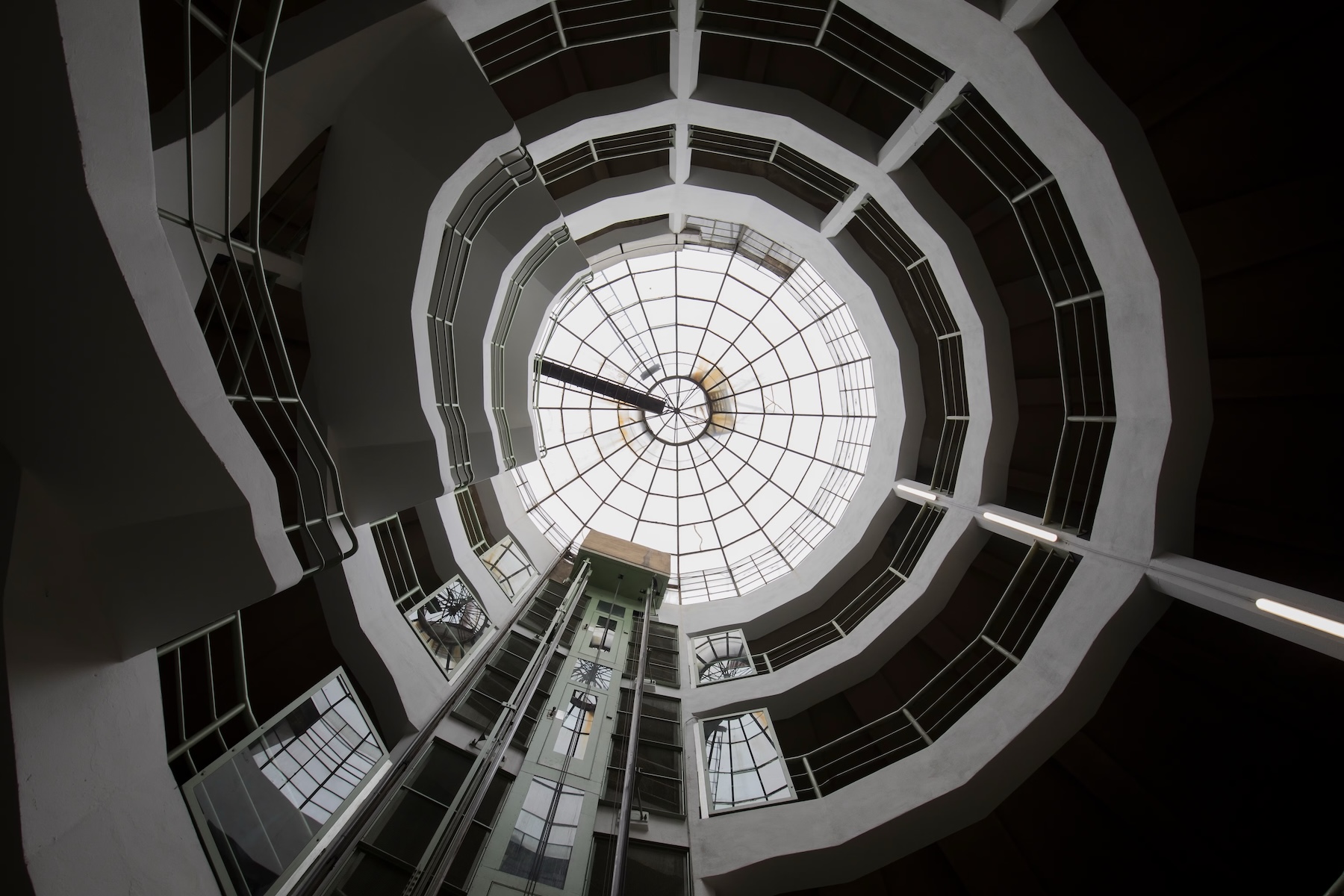 Looking up the spiral ramp of the 1930s Astoria Garage in Vienna to its glass dome | The Aficionados