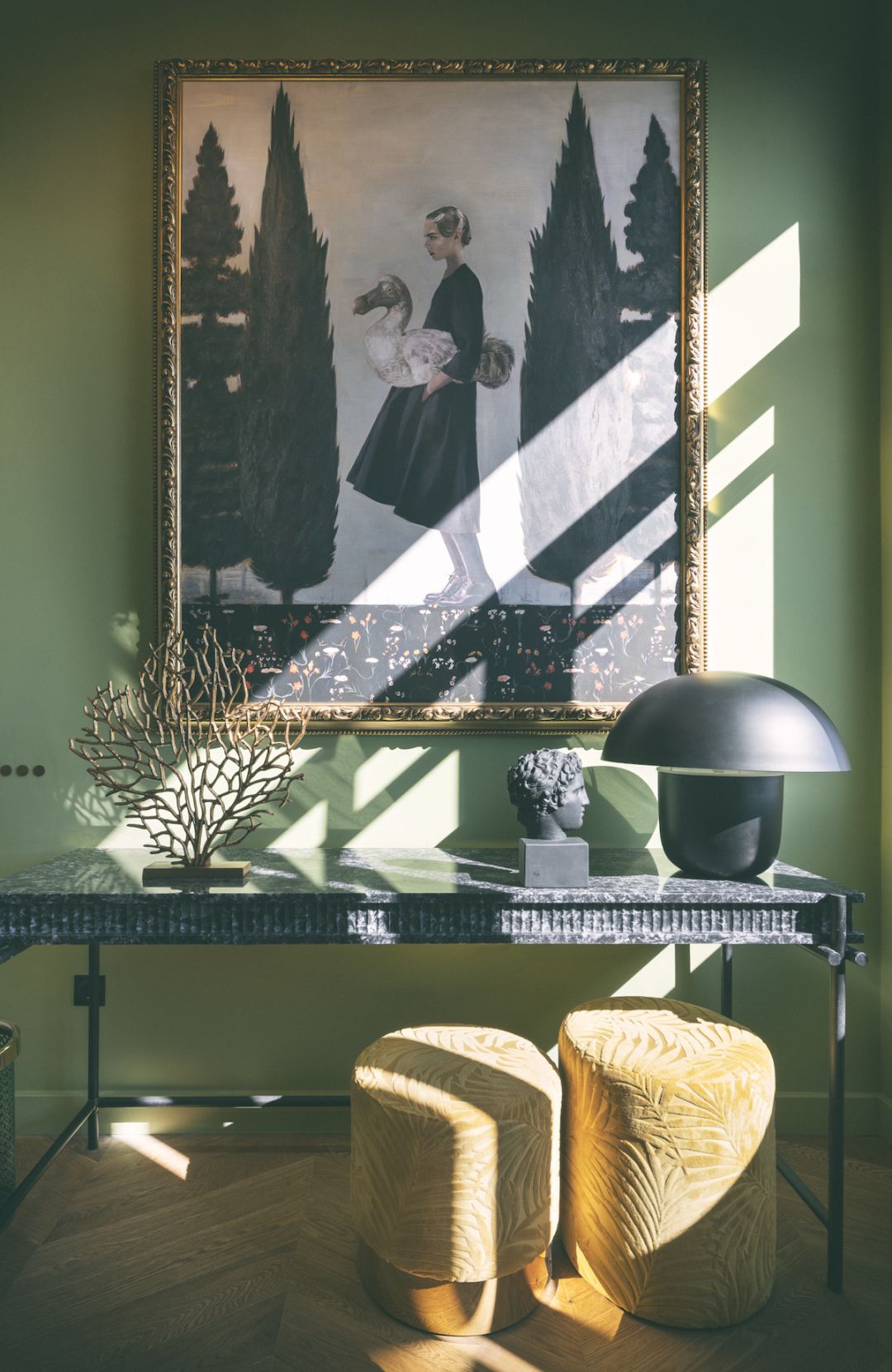 A collector's interior with an antique portrait, marble console and classical bust in green-washed light, an Aesthetes design hotel | The Aficionados