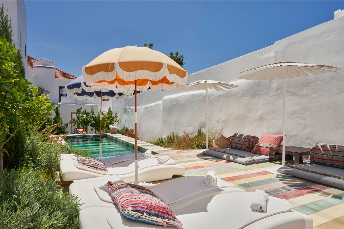Bright ornage and sunshine inspired patio and pool in multi coloured tiles at Casa Fortunato in Alentejo Portugal | | The Art of Desking: Stylish Hotels for Work, Rest & Play – The Aficionados