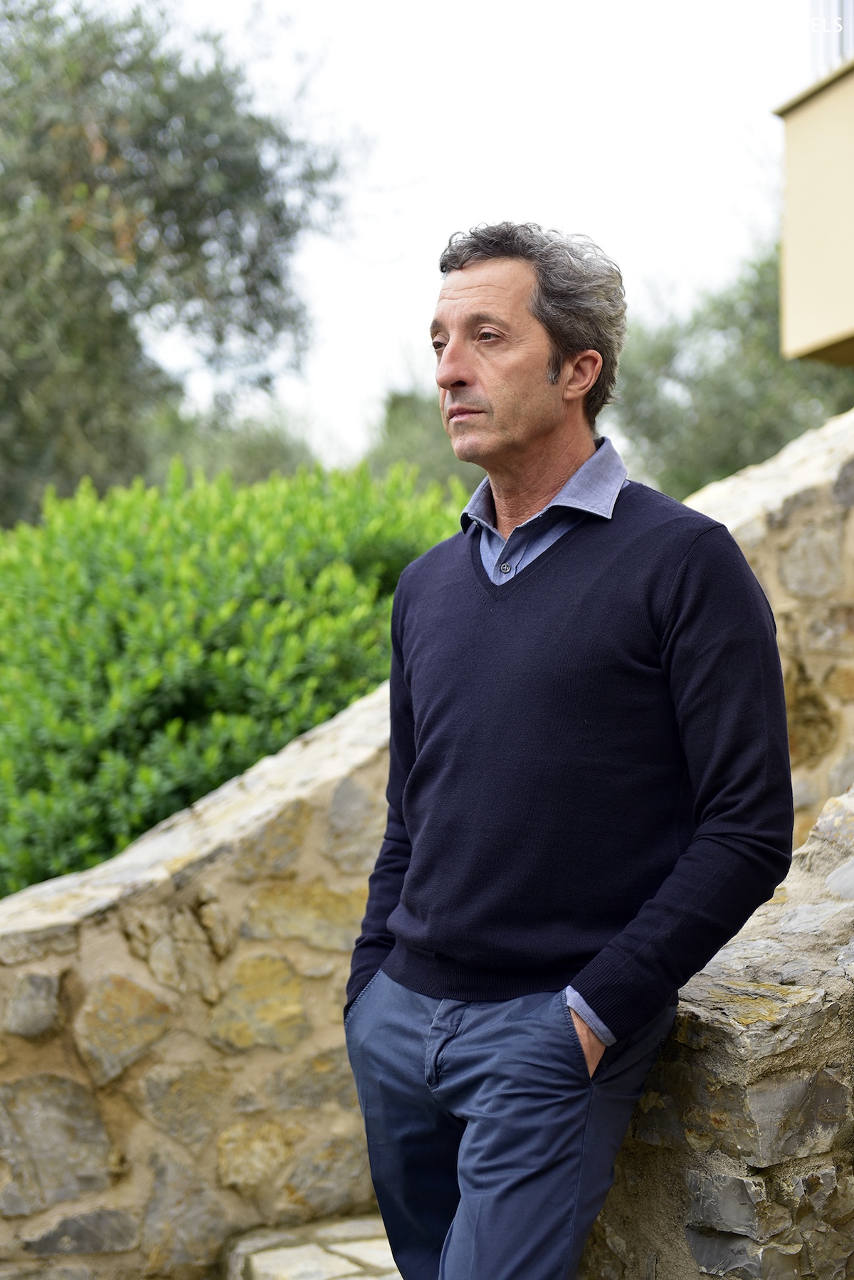 Man in blie standign on the steps fo the Locanda al Cole Tuscany | Manmade: 12 Hotels Shaped by Men of Design and Style