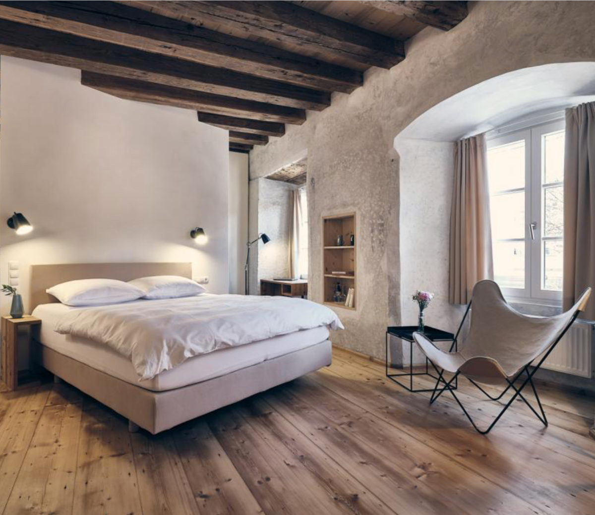 Hotel interior Design in white, Cloud Dancer, Timbered flooinrg aged propoert conversion from 1450. | Pantone's Mocha Mousse: Warmth of Design, Travel and Colour-led Hotel Style
