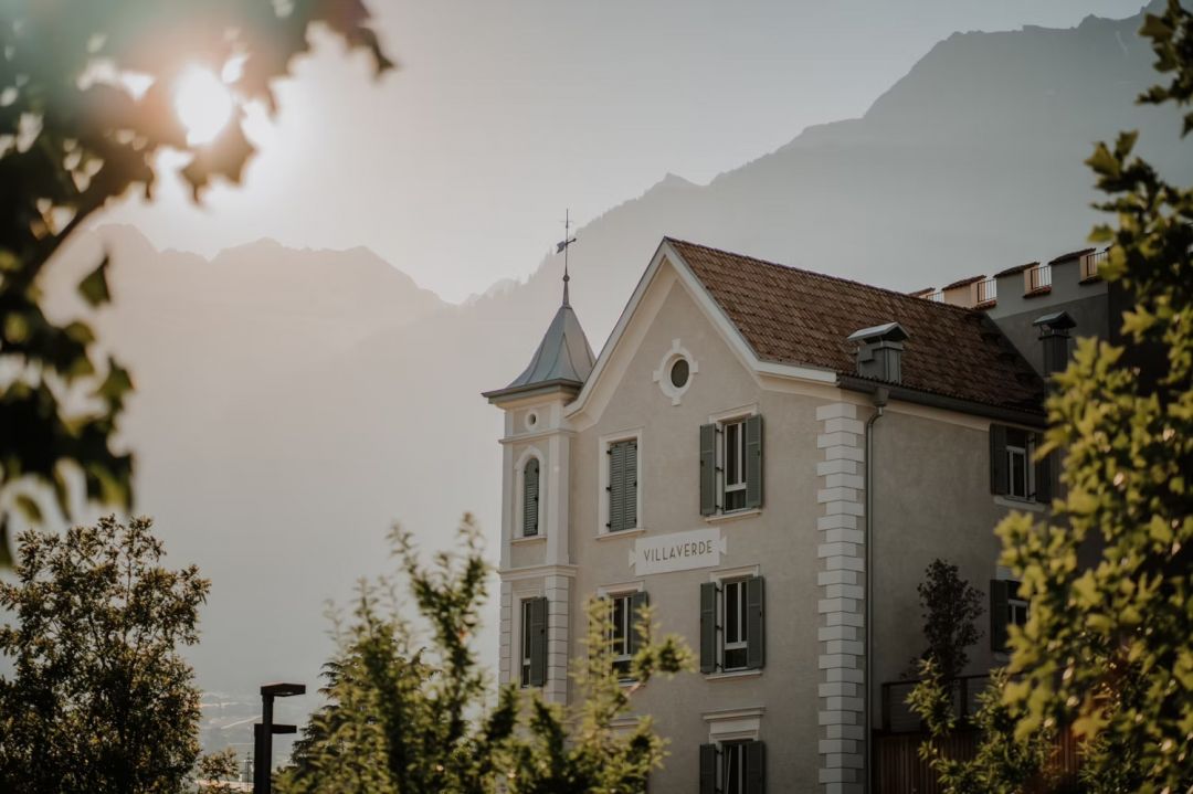 VillaVerde Hotel facade against the sunrise over the Alps |Poetic Design Hotels & Creative Hideaways Across Europe – The Aficionados