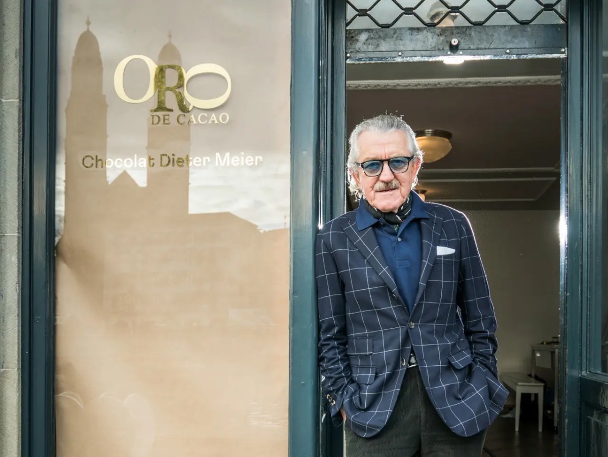Former Band member yello outiside of his cholocate shop in Zurich | Pantone's Mocha Mousse: Warmth of Design, Travel and Colour-led Hotel Style