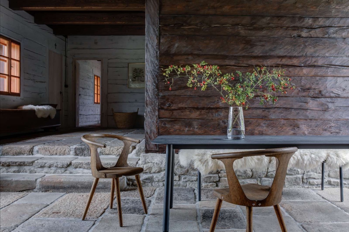 Stone flagged florring against a dark wood aged walling found at boutique hotel Mezi Lukami | Pantone's Mocha Mousse: Warmth of Design, Travel and Colour-led Hotel Style