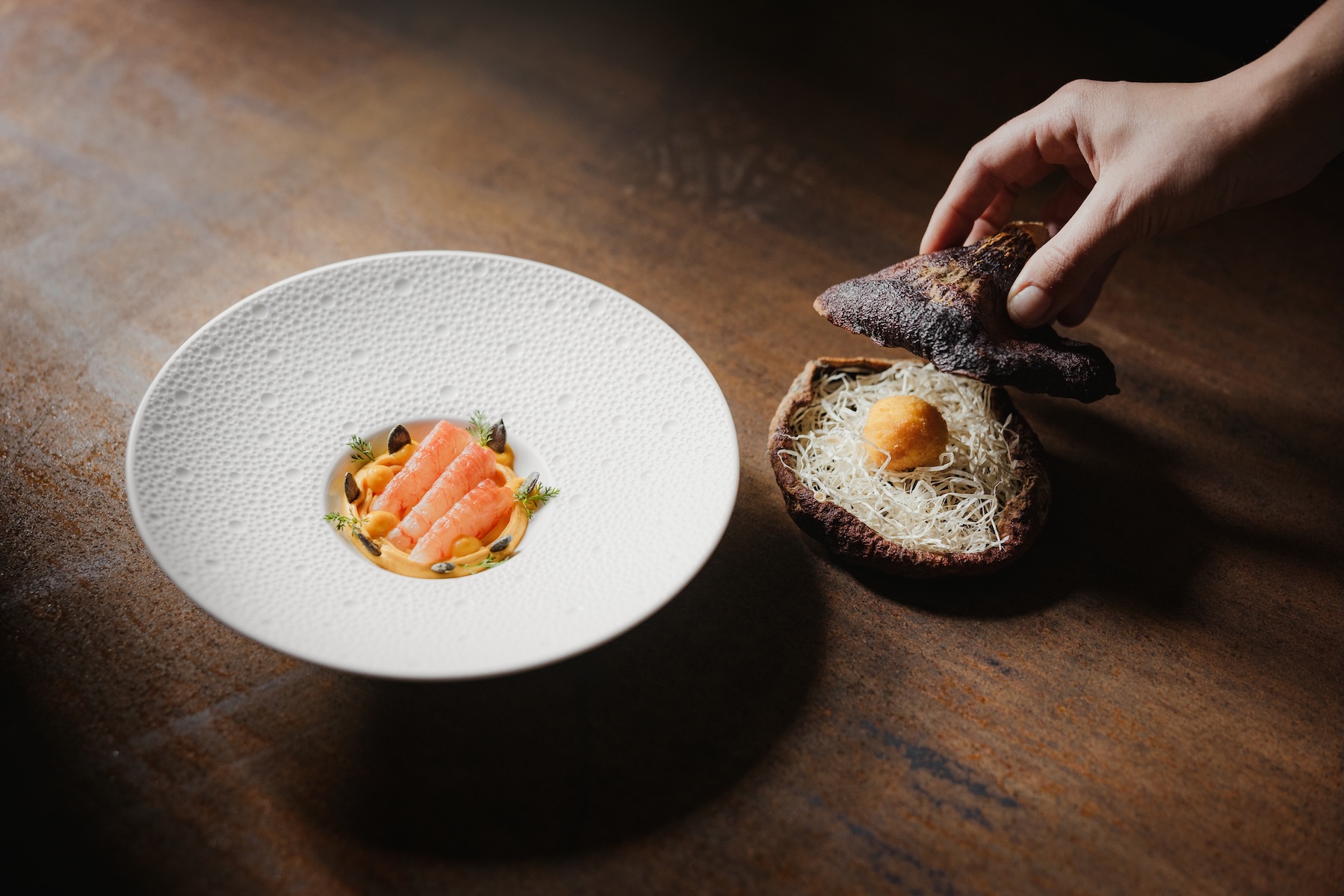 Alpine fish course with dark rye bread vessel, La Lumosa tasting menu, Ansitz Steinbock South Tyrol