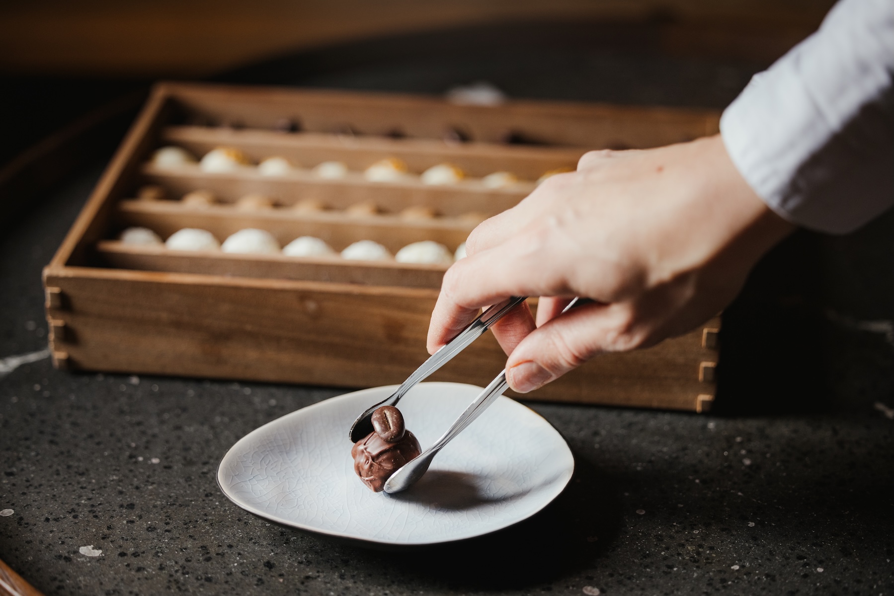 Handmade petit fours being plated at La Lumosa, Ansitz Steinbock fine dining, South Tyrol