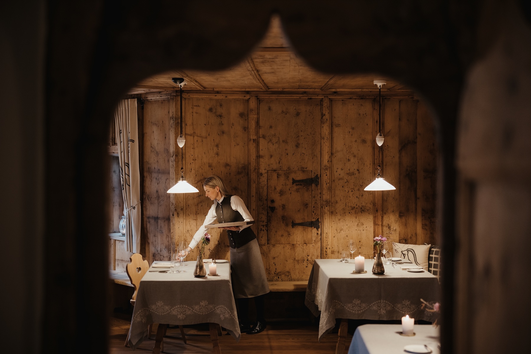 Staff setting tables in the La Lumosa dining room, Ansitz Steinbock, Villandro, South Tyrol