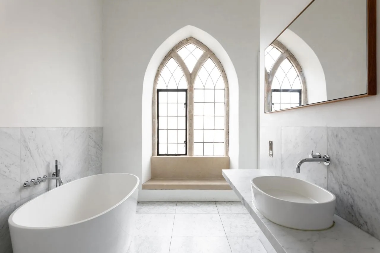 Beautiful Church-like windows leaded in this white bathroom setting within an historical hotel| At the Chapel, Bruton – Boutique Hotel, Dining & Design Retreat in Somerset | The Aficionados