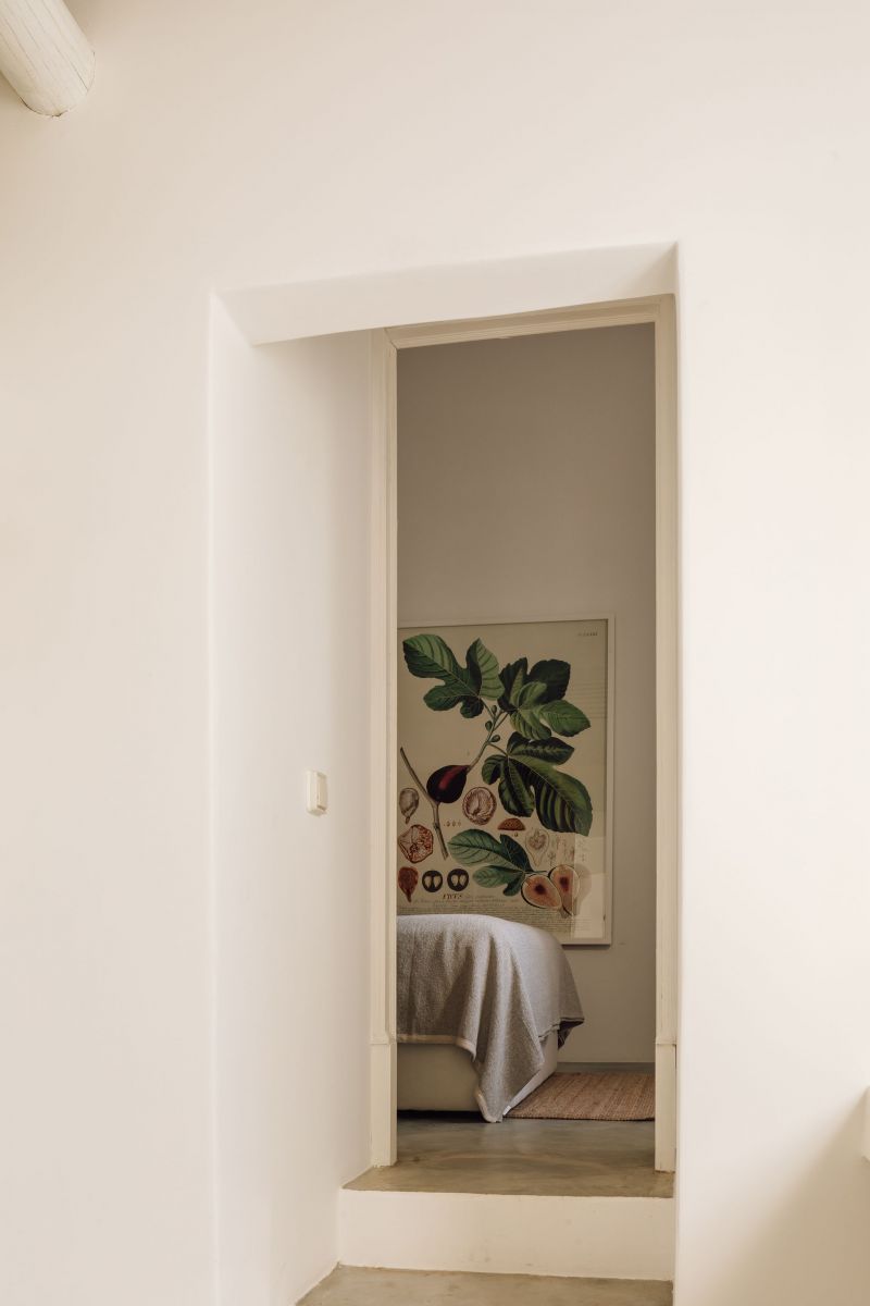 Hospedaria, Tavira, Algarve: whitewashed riad-style doorway framing a bedroom, barefoot-brutalist design by Luís Costa Valente, Atelier RUA.