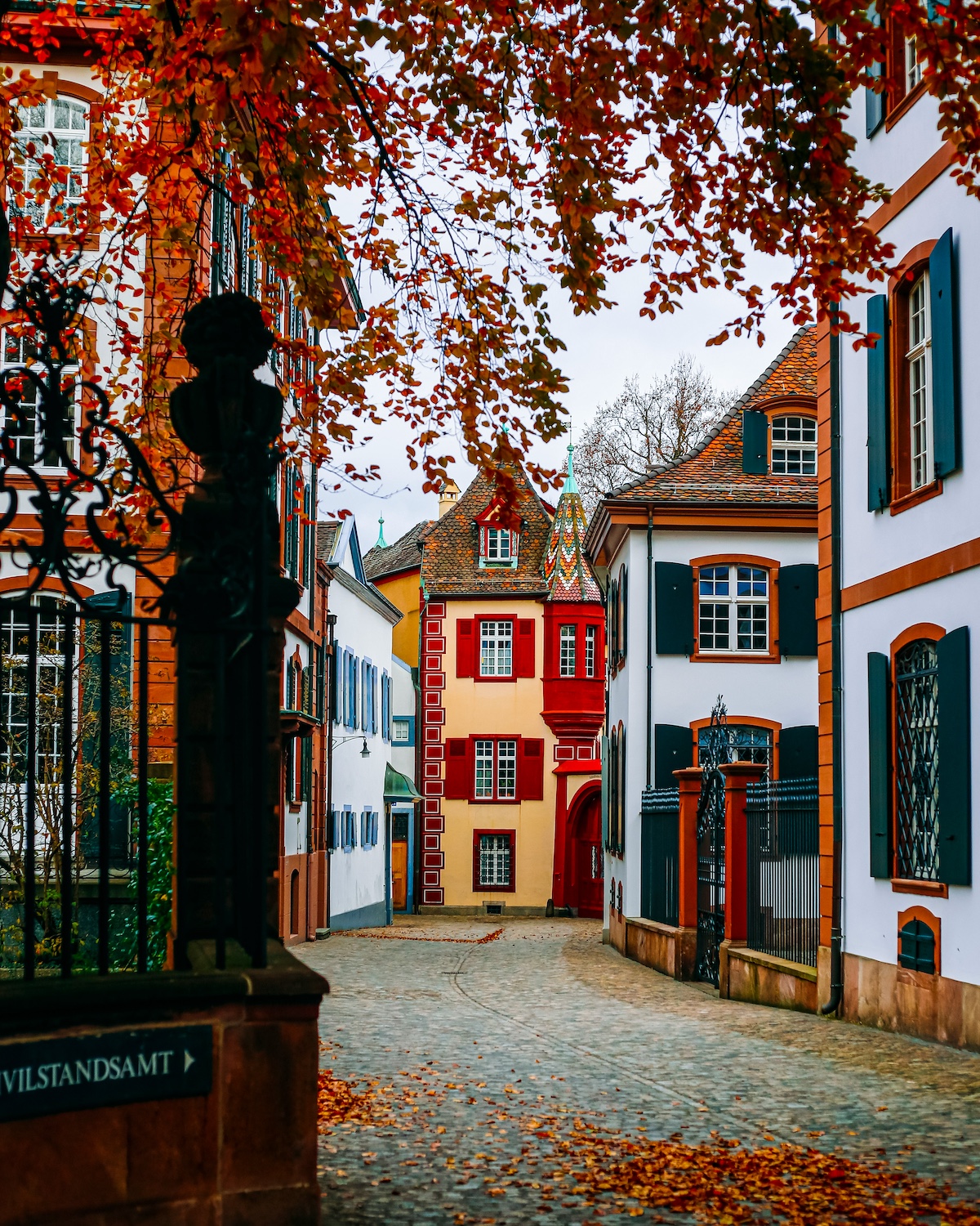 Medieval Towns of Europe - typical narri=ow houses painted in yellow and reds | Basel Travel Guide: Art, Architecture and Cultural Depth at the Heart of Europe | The Aficionados 