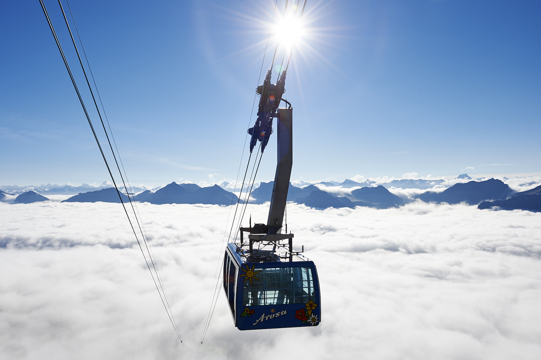 Cable Ski Car over a sonny snow Alps | Ski Arosa Lenzerheide, Swiss Alps – Alpine Thrills in Graubünden