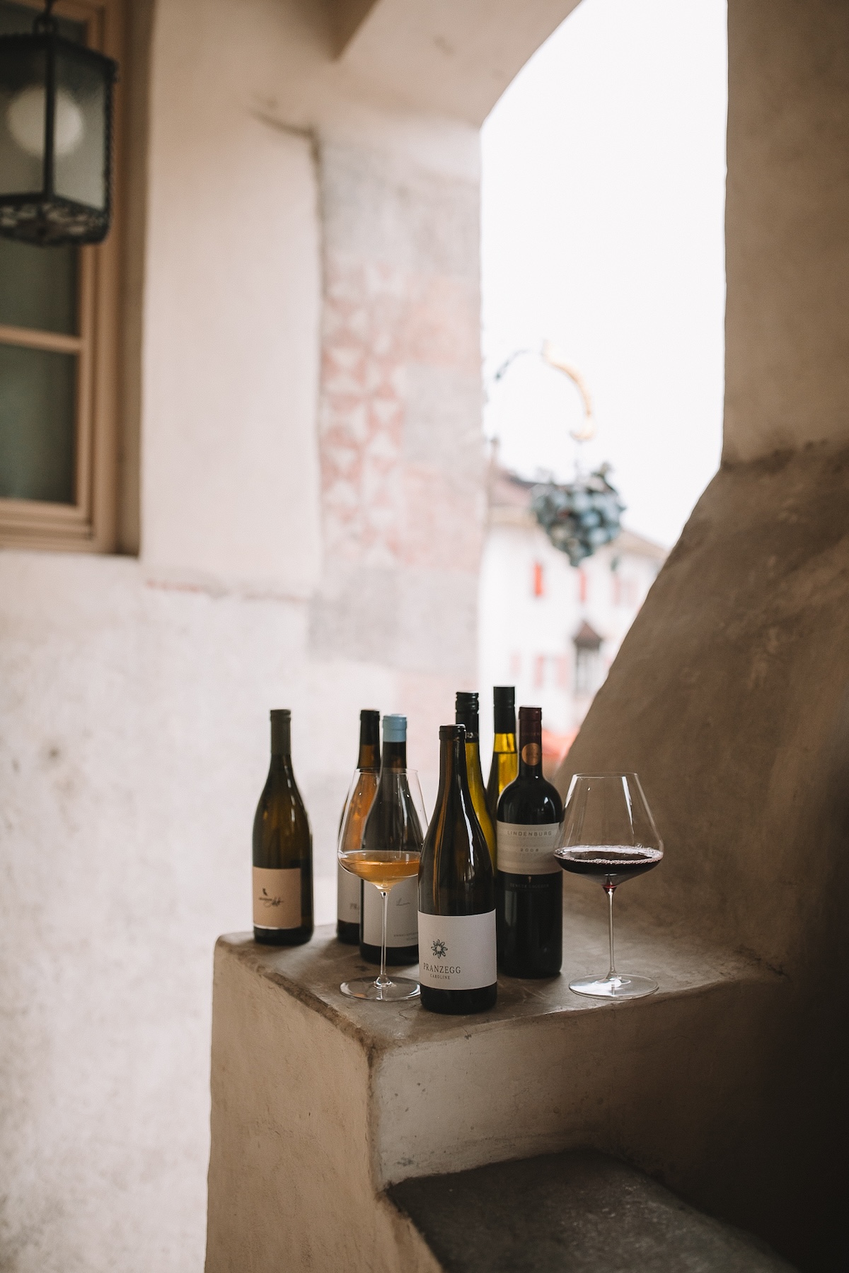 Small-grower South Tyrolean and Alto Adige wines lined up on the stone window ledge at Blaue Traube, Algund | TheAficionados.com