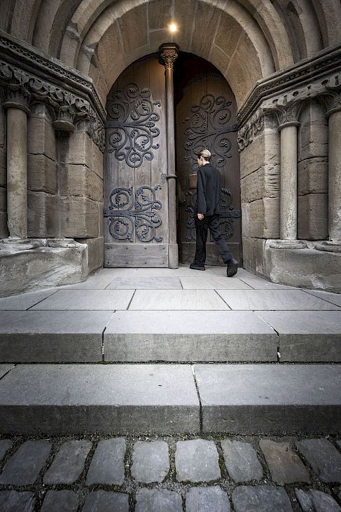 Medieval Architecture | Church doorway, wooden doors ornate stone arching above |Dinkelsbühl Bavaria: Design, Boutique Hotels and Travel Guide