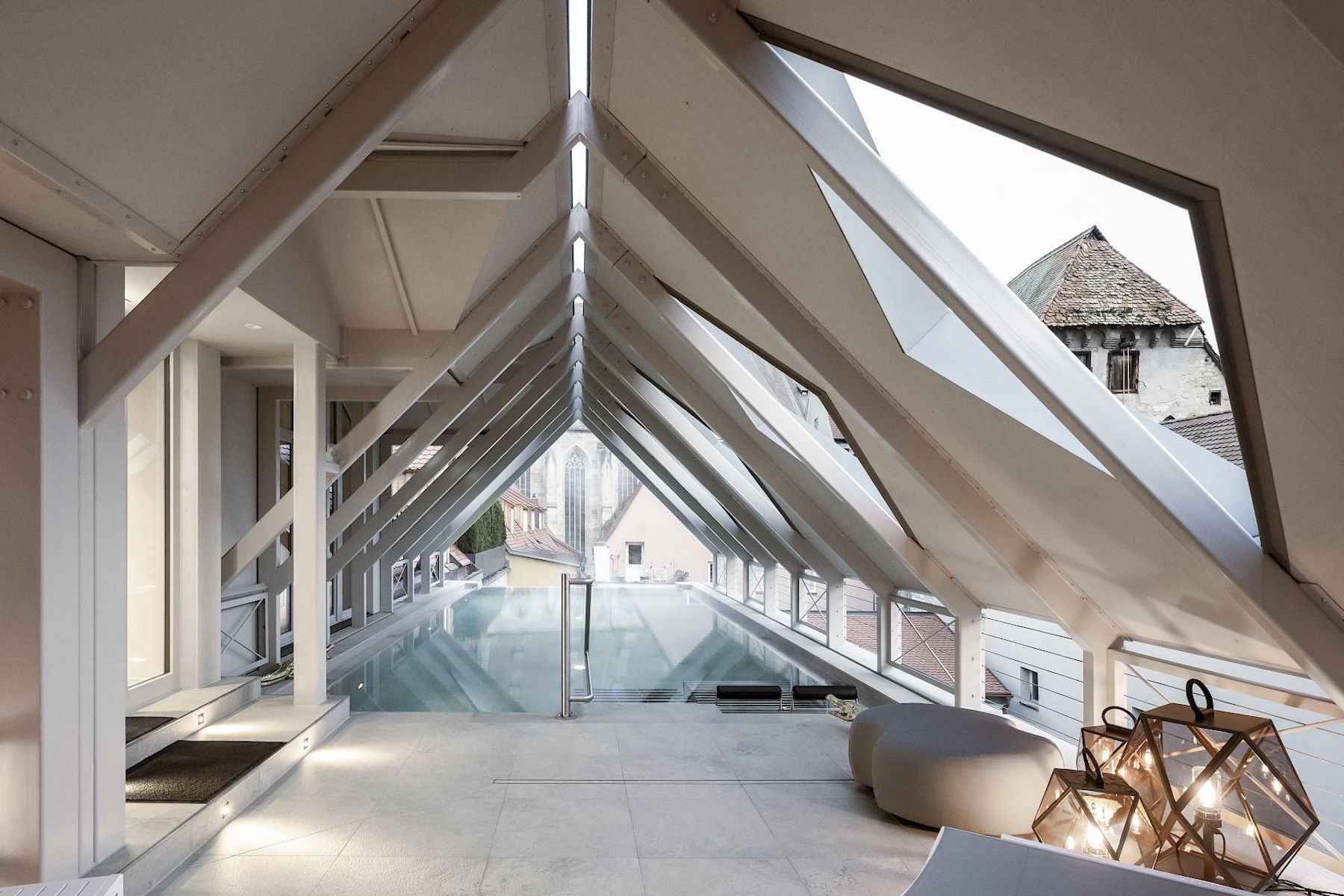 Goldene Rose rooftop infinity pool by NOA architects framing Dinkelsbühl cathedral, Bavaria | The Aficionados.