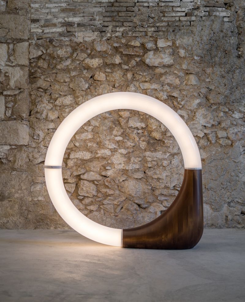 Circular neon tube mounted onto a wooden anchor - contemporary lighting installation CARWAN Galleery Athens |The Art of Desking: Stylish Hotels for Work, Rest & Play – The Aficionados