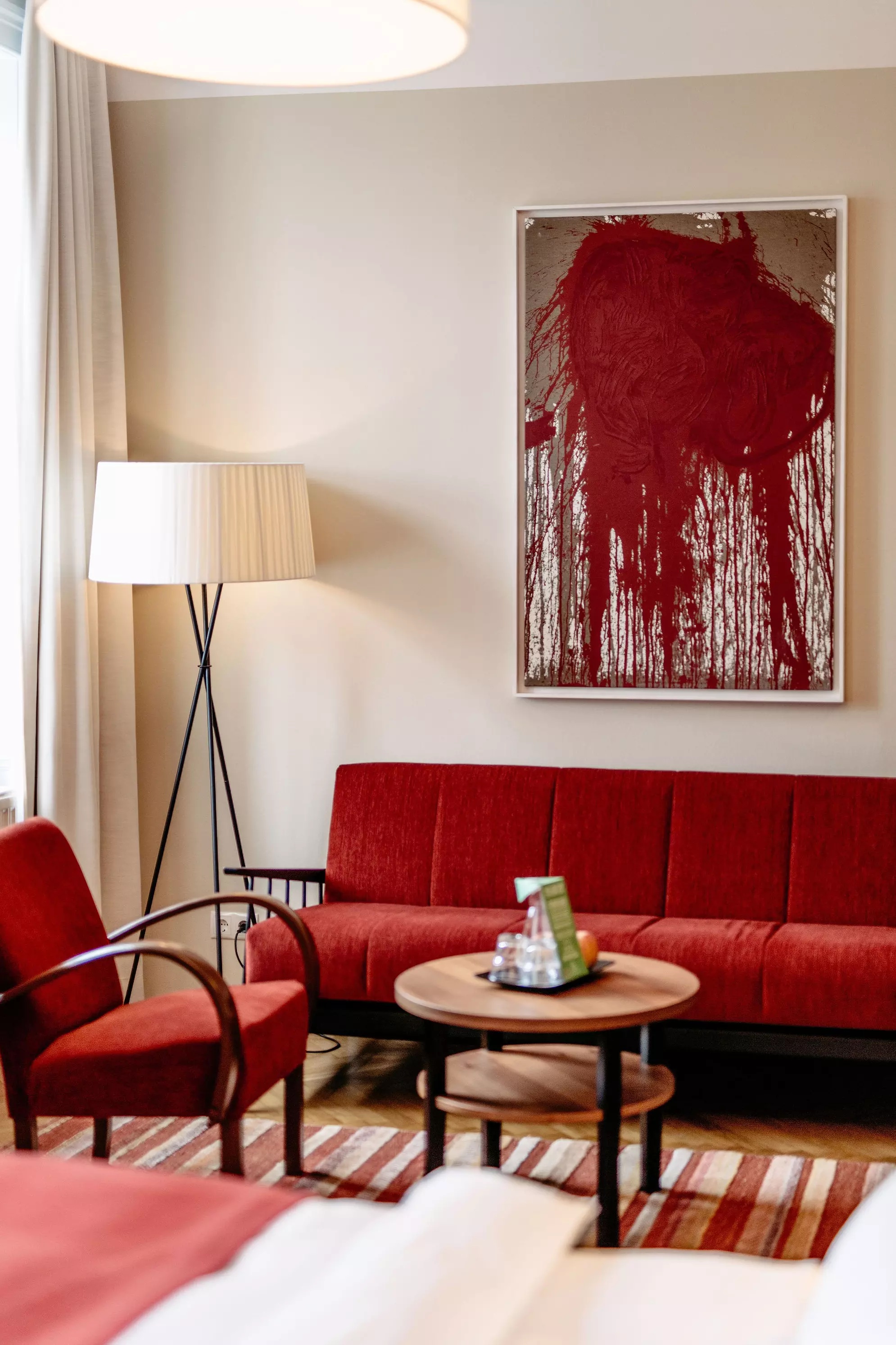 Contemporary art hotel in red, red salon sofa Hotel interiors historiy | Otto & Co: The Story of Hotel Altstadt Vienna | Otto, Saskia & Lisa Wiesenthal