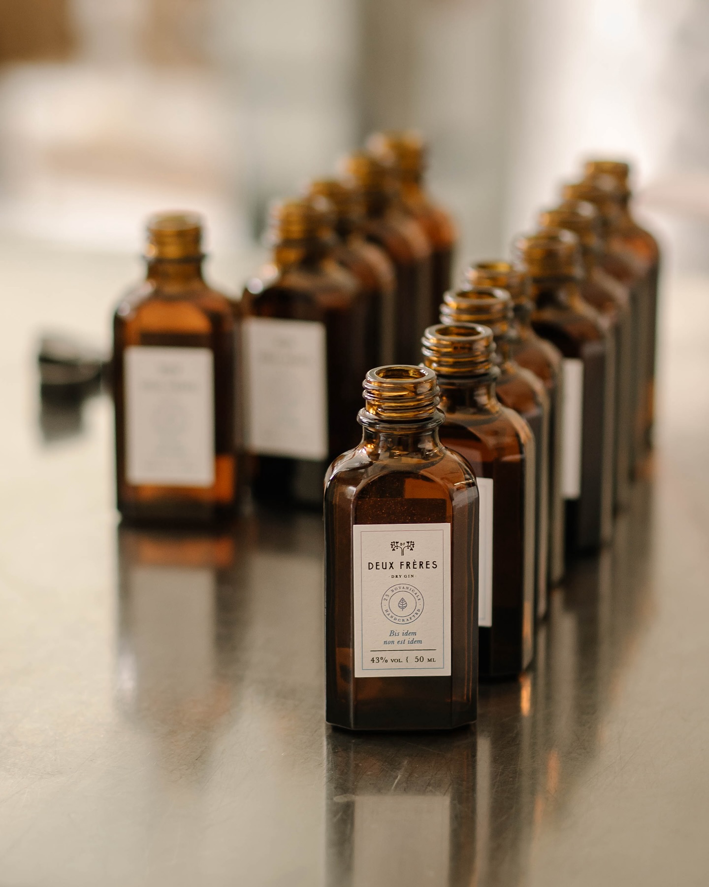 Bottles of small batch made Gin | brown apothecary bottles |Deux Frères Gin: Zurich’s Pink-Hued Rebels of Distilling 