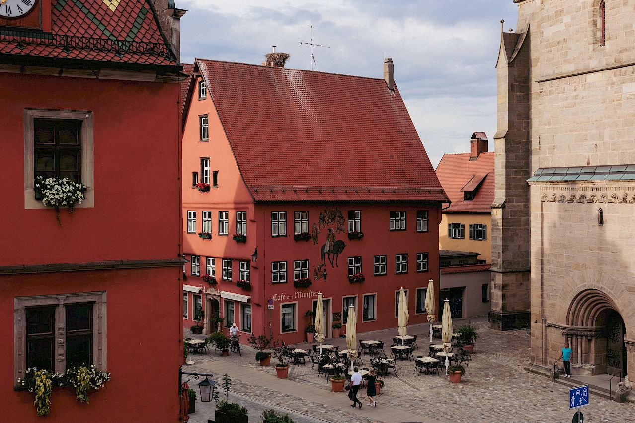 Red painted historic houses in the Bavarian style dotted around the market square | Dinkelsbühl Bavaria: Design, Boutique Hotels and Travel Guide 