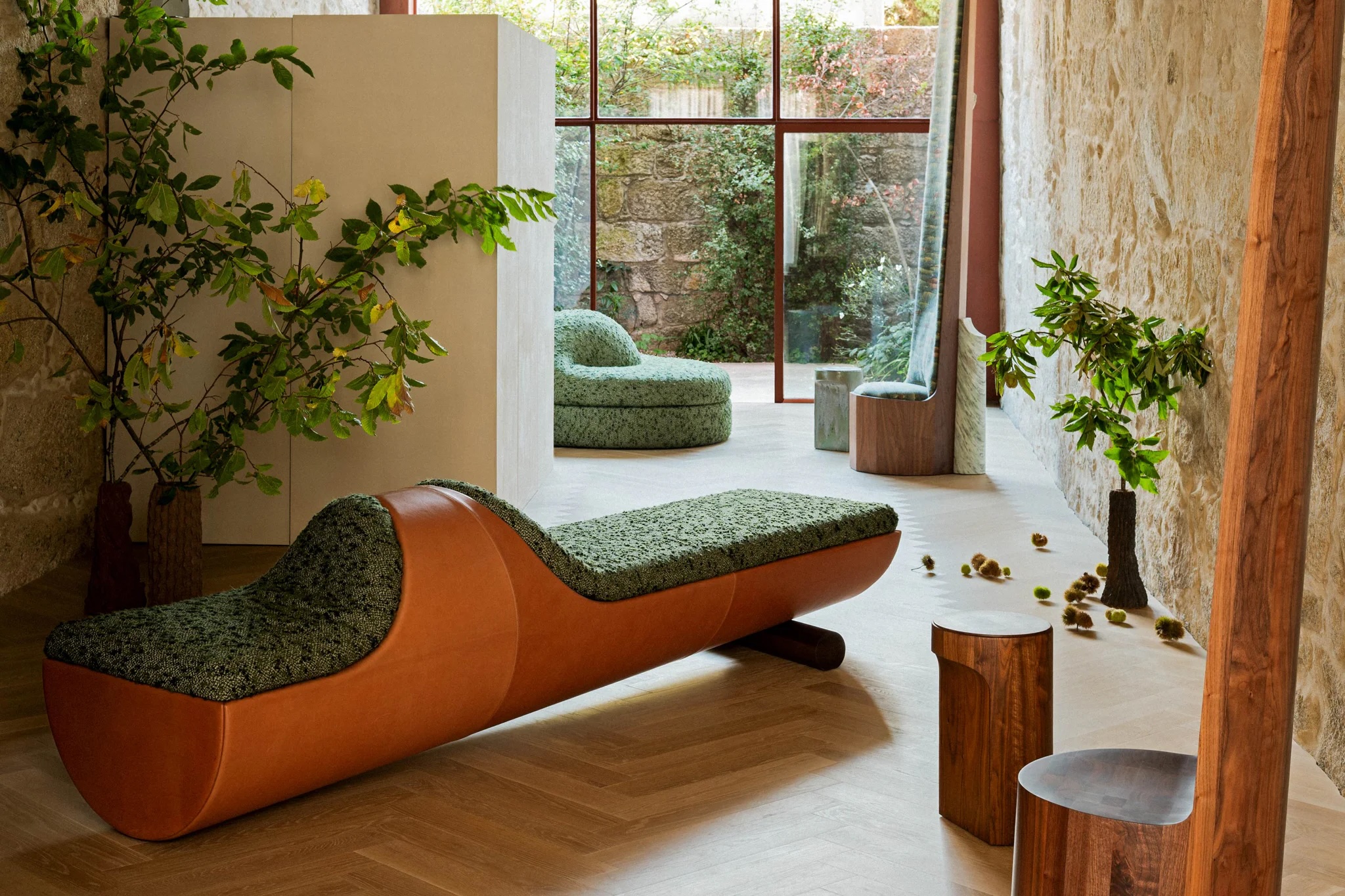 Curved daybed in tan saddle leather and textured green wool from the Ensemble collection by Sam Baron for De La Espada | The Aficionados