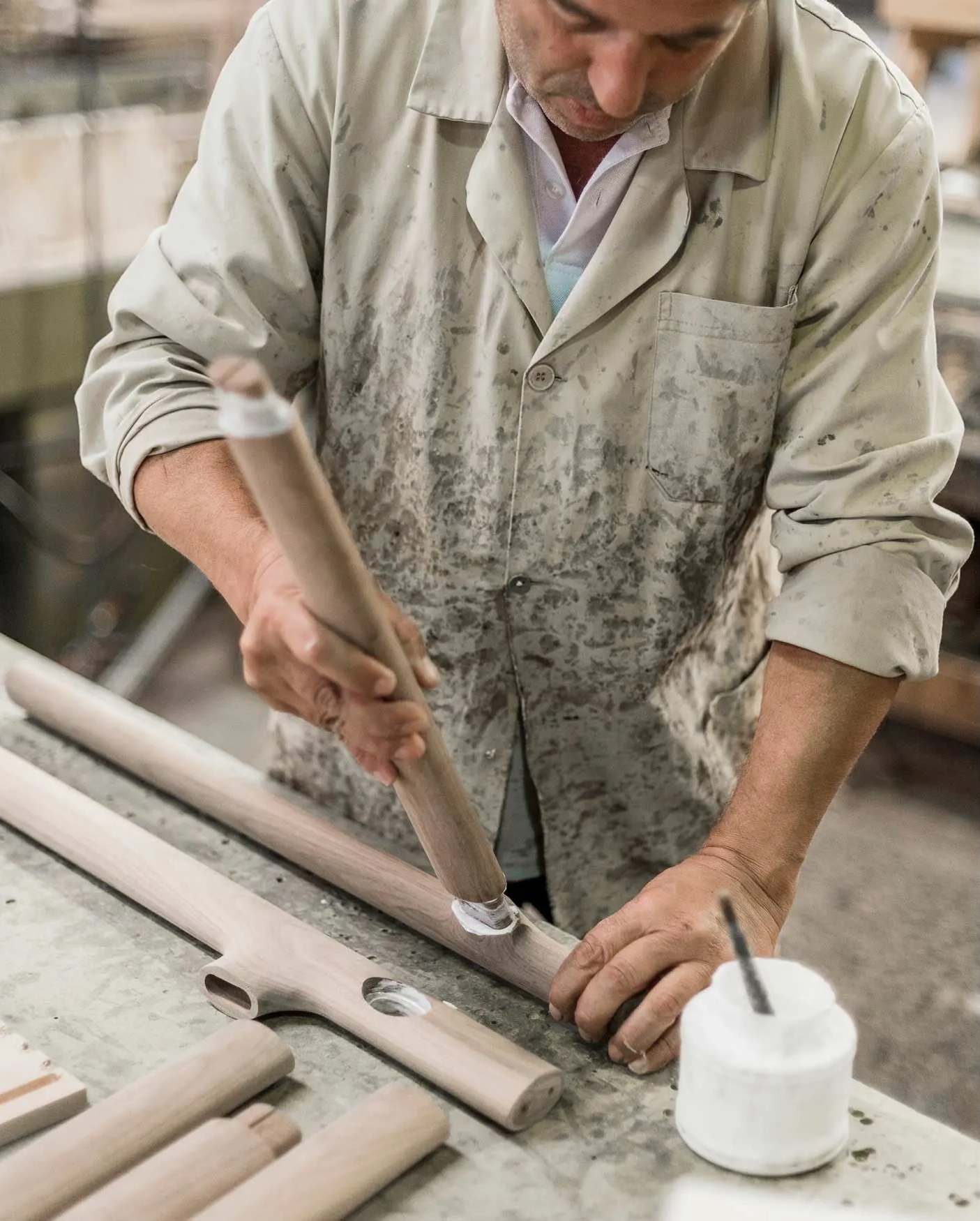 A De La Espada craftsman hand-finishing turned chair components at the Mira workshop in Portugal | The Aficionados