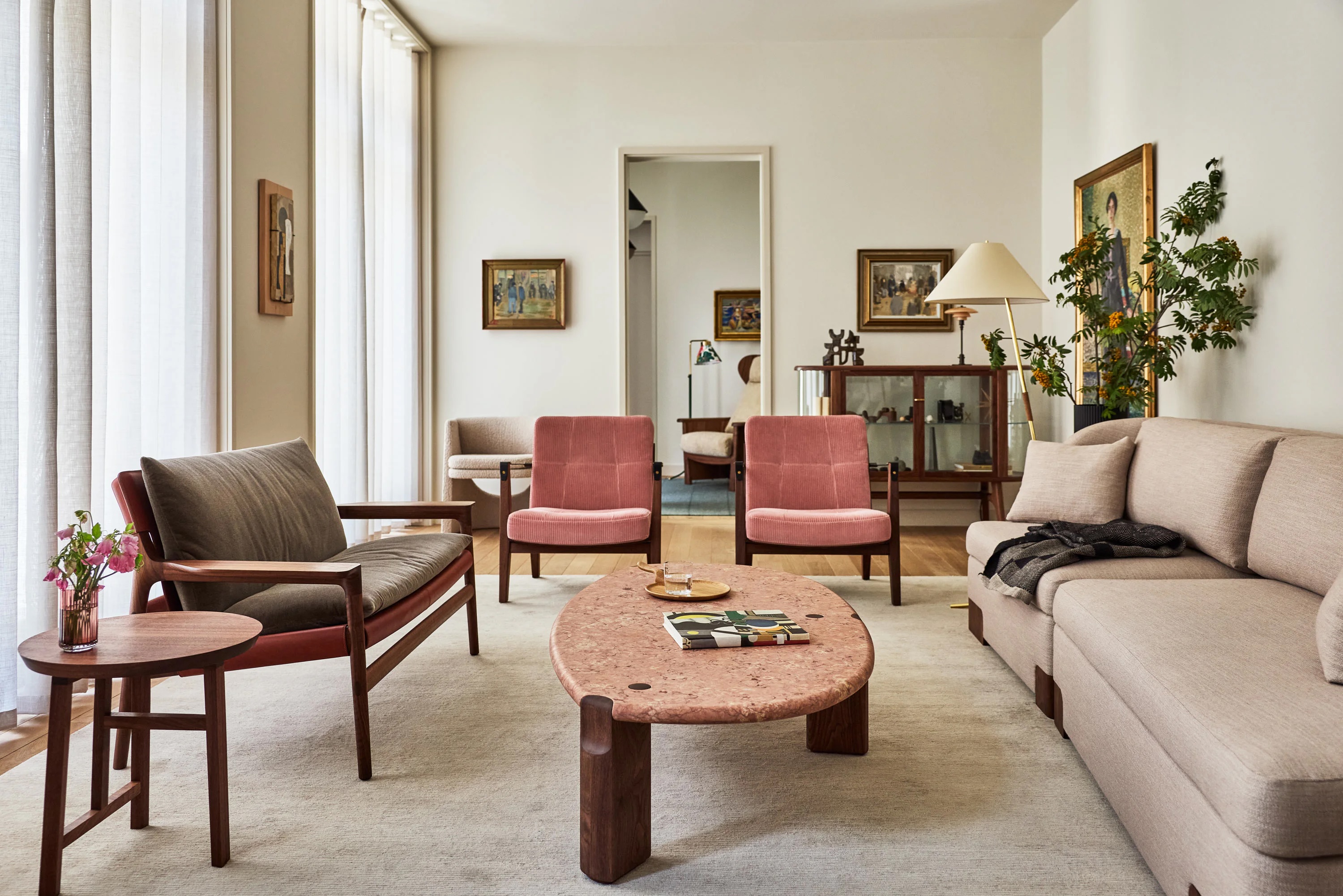 Living room of the De La Espada townhouse in St John's Wood, with rose corduroy lounge chairs and a pink marble table | The Aficionados