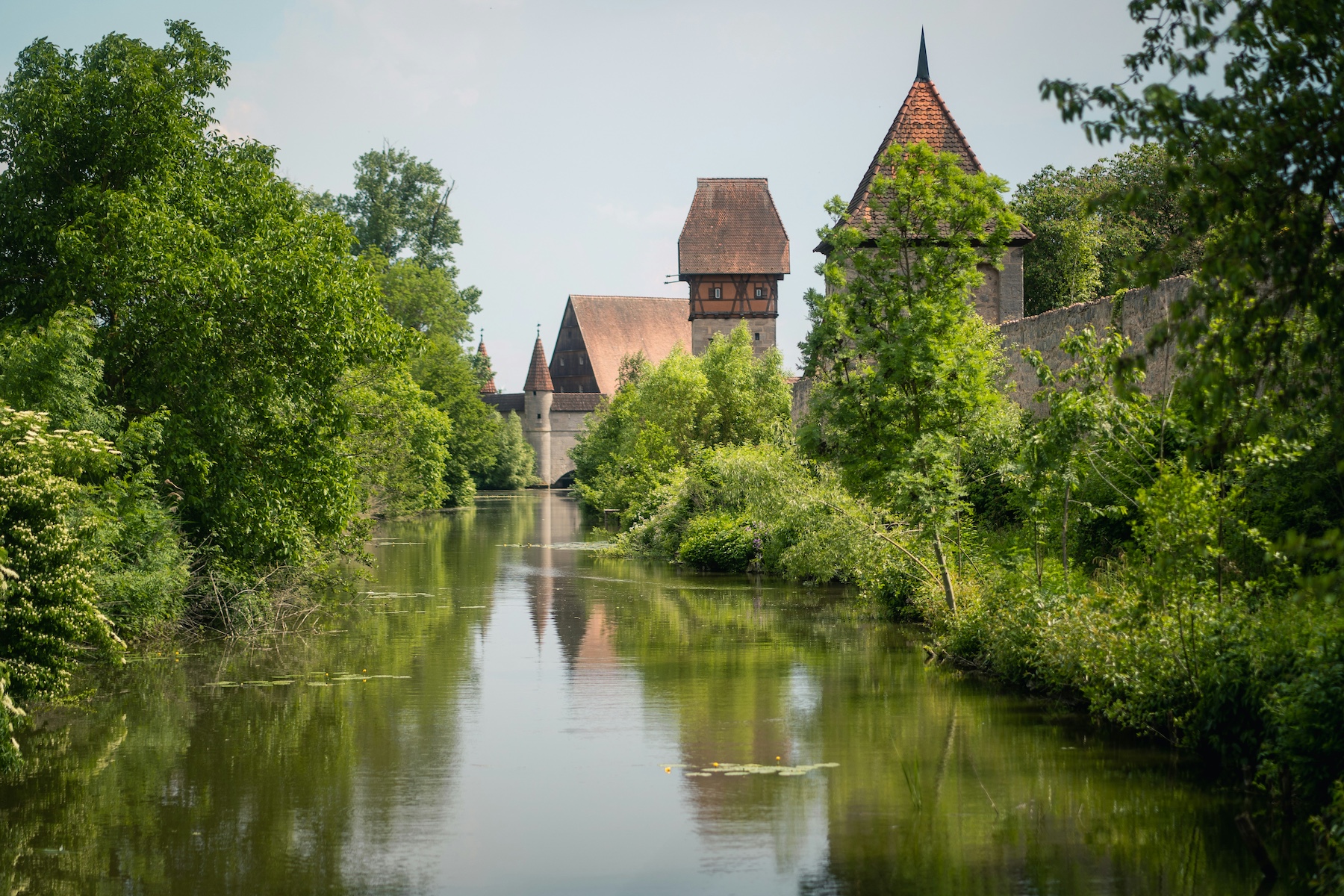 Wörnitz River with gothic towers on the skyline Dinkelsbühl Bavaria: Design, Boutique Hotels and Travel Guide