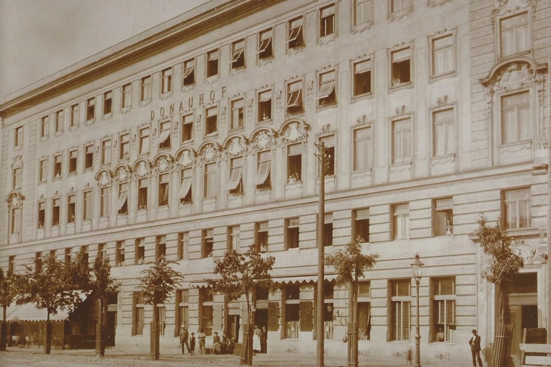 Archive photograph of the original Donauhof building in Vienna, its name lettered across the upper facade