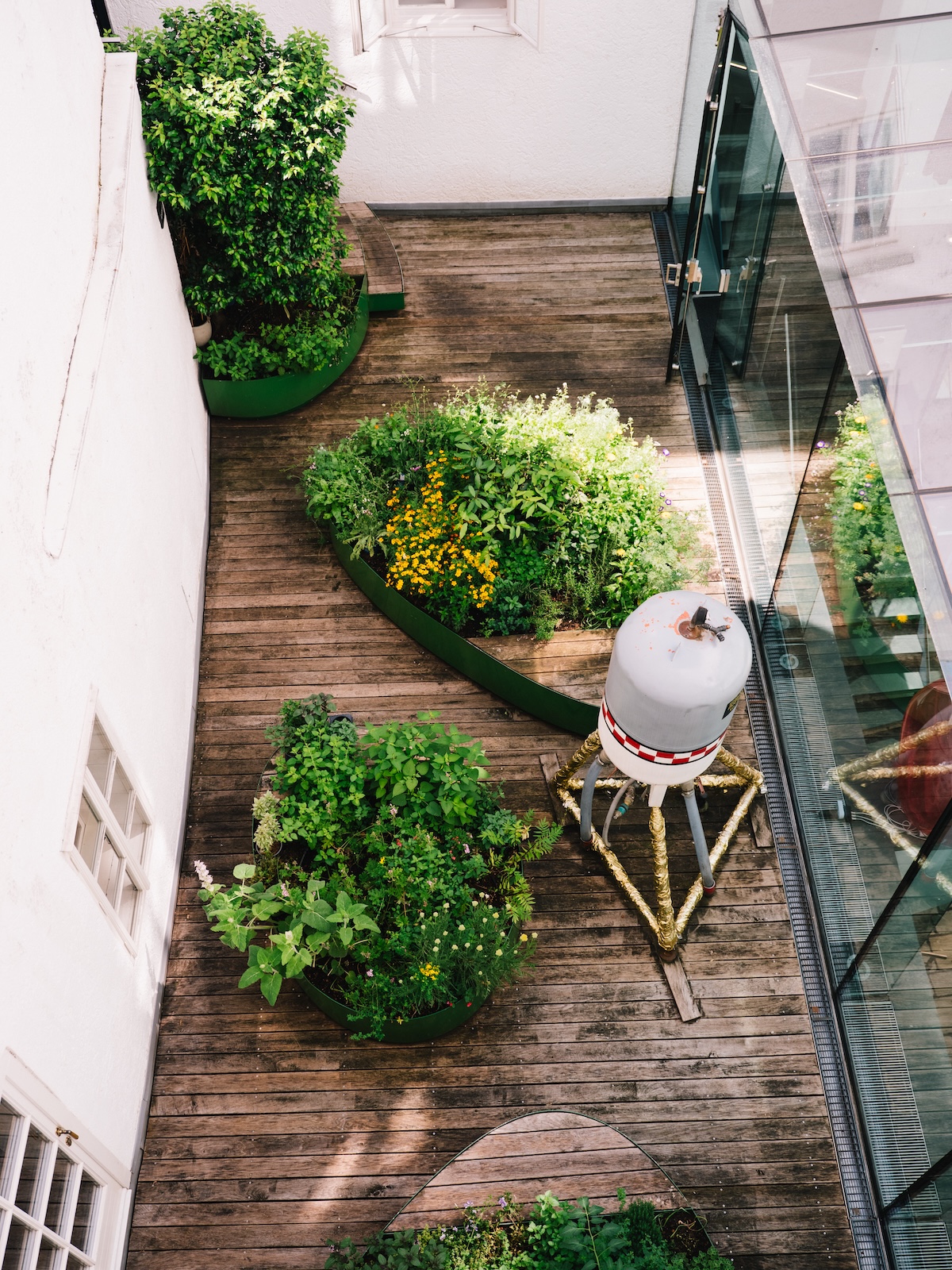 The glazed courtyard of the Arthotel Blaue Gans, with David Moises's Vertigo Rocket in the atrium garden | The Aficionados