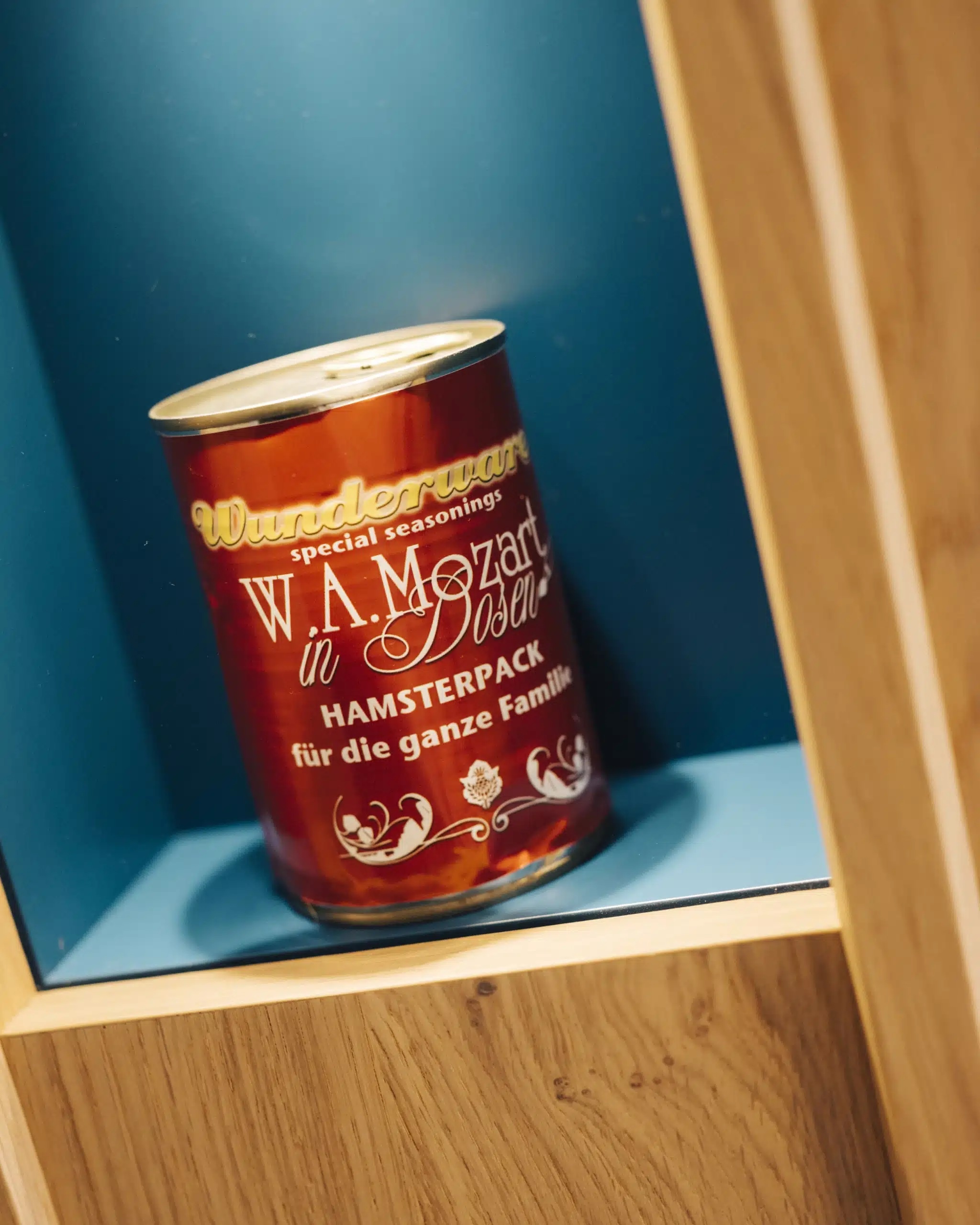 Wunderware tin, W. A. Mozart in Dosen, in a shelf niche at the Arthotel Blaue Gans, Salzburg | The Aficionados