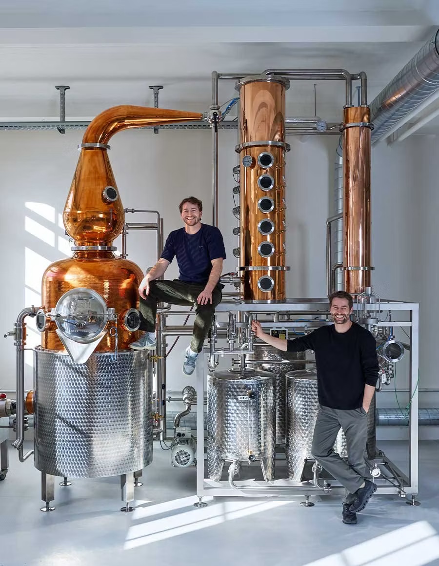 Gian + Florian Grundböck in front of the copper distillery Holstein |Deux Frères Gin: Zurich’s Pink-Hued Rebels of Distilling