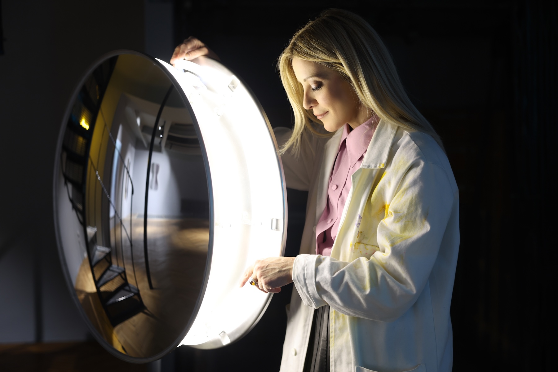 Lighting Artist Billi Thannert with a glowing circular light sculpture, visual direction for the TurboTaube pop-up in Vienna | The Aficionados