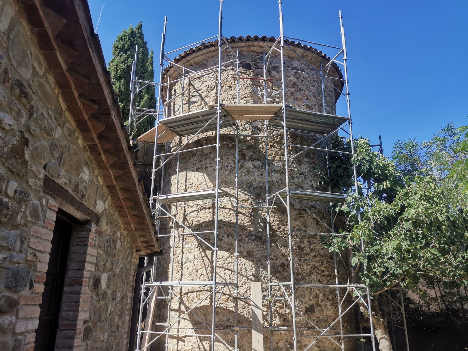 Bell tower being restored | Convent architecture, tower with scaffolding |Vocabolo Moscatelli: A 12th-Century Monastery Reborn as a Boutique Design Hotel in Umbria